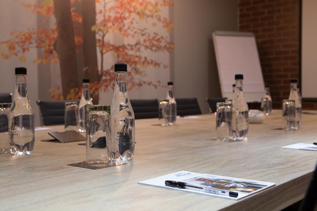 Menlyn Boutique Hotel Pretoria Exterior photo Bottled water on a conference table